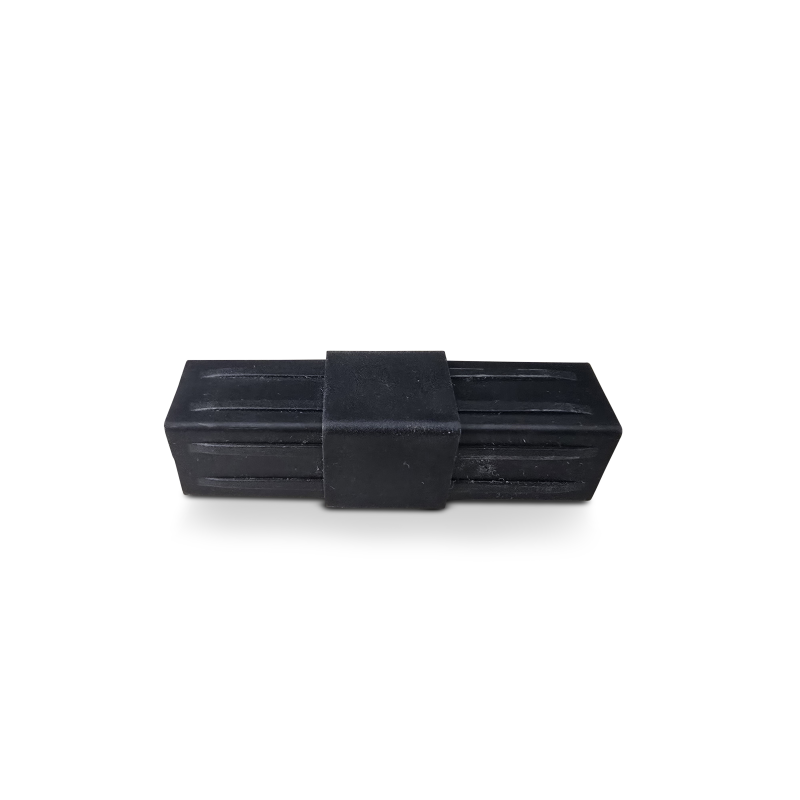 Small black plastic rectangle with central band and surface grooves.