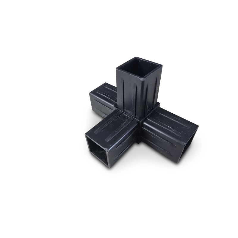 Black four-way pipe connector with square openings on a plain black background.