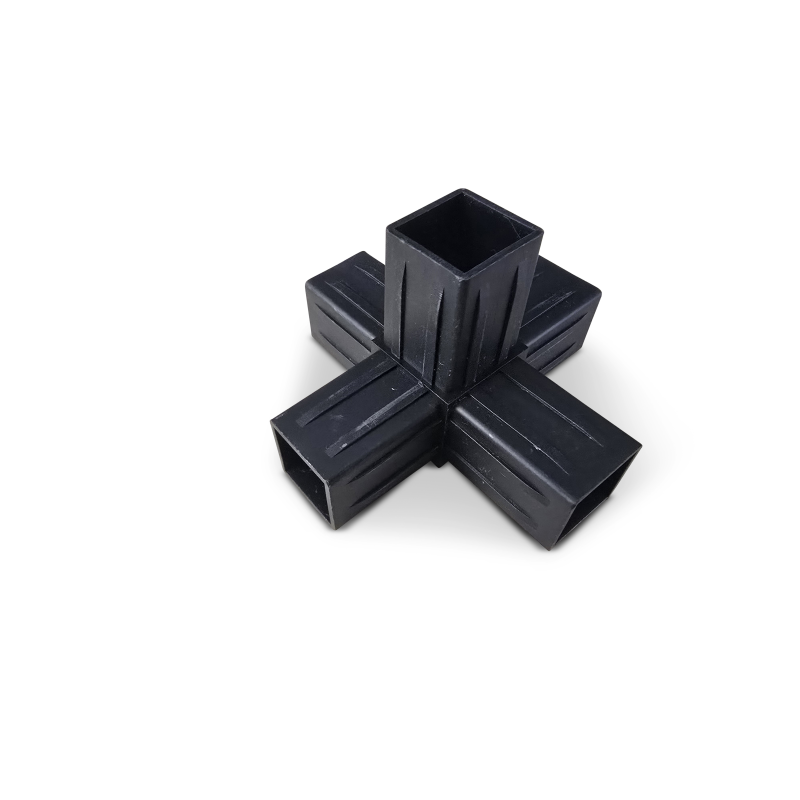 Black plastic cross-shaped connector with four hollow extensions on solid black background.