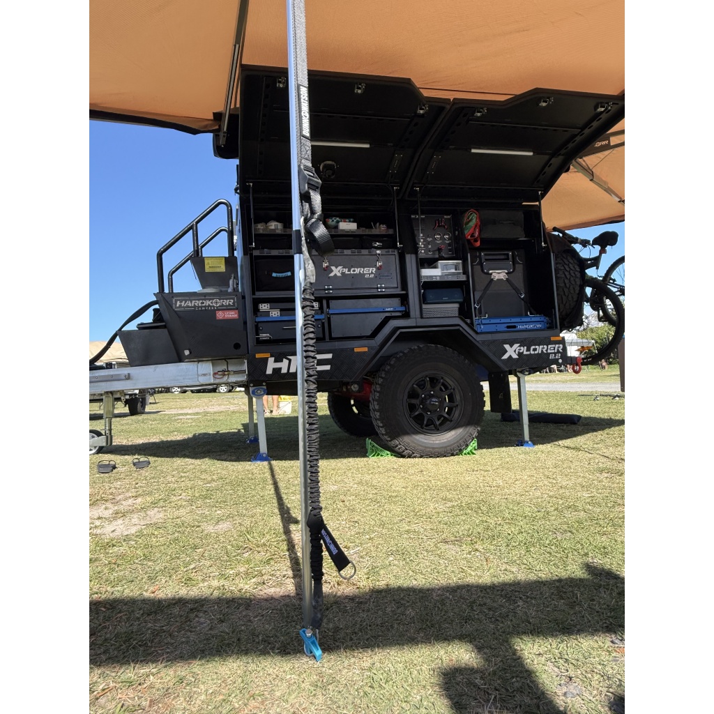 Example Of Soft Spring Tie Down Strap Securing Awning At Base